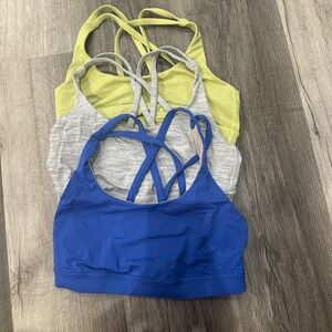 Women's Lululemon Energy Bra Blue, Space Ice Grey Alpine, and Lime Sports Bras
